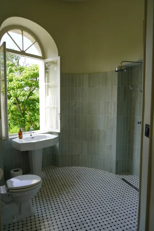 Bathroom in a turret with luxury shower and marble floor