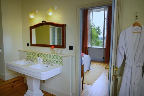 Bathroom and sink with views into the bedroom