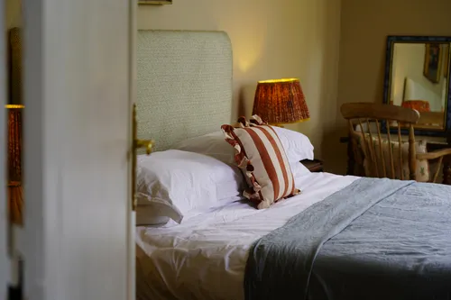 Views into the bedroom and bed