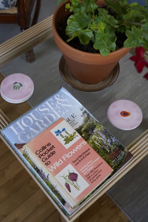 Details in the bedroom reading corner. Magazines and books on a coffee table