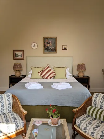 Bed and armchairs with cosy interiors